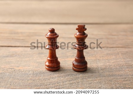 Chess pieces on wooden background