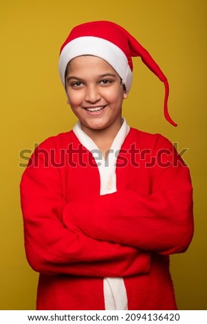 Happy Kid Wearing dress of santa stock photo