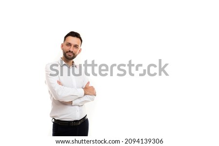 business portrait of a man businessman in a shirt on a white background with arms crossed on his chest