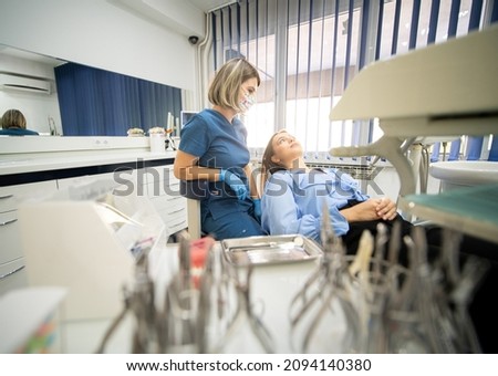 Visiting friendly and professional dentist , high photo 