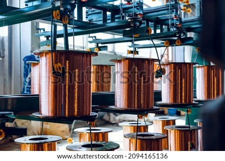 Production of copper wire, cable in reels at factory. Cable factory. Royalty-Free Stock Photo #2094165136