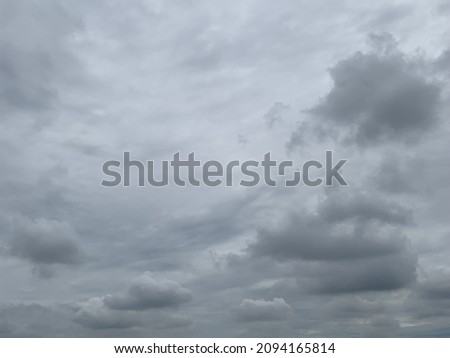 When the air rises, it creates an atmosphere. Gray stratocumulus clouds rise into the sky and change to Nimbostratus clouds. Heavy rain in Thailand. no focus