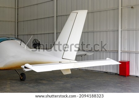 Close-up of part of the fuselage of a small aircraft Royalty-Free Stock Photo #2094188323