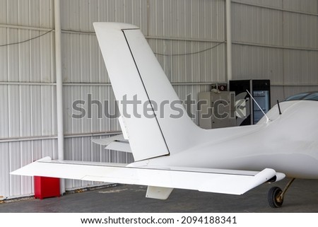Close-up of part of the fuselage of a small aircraft Royalty-Free Stock Photo #2094188341
