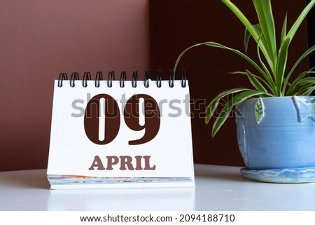 Memory and important date April 9, desk calendar - spring season.