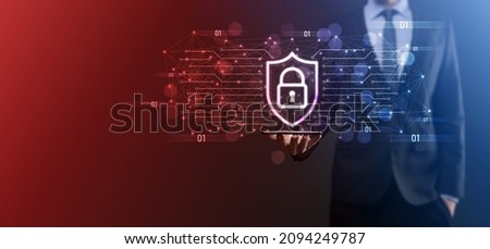 Protection network security computer and safe your data concept, Businessman holding shield protect icon. lock symbol, concept about security, cybersecurity and protection against dangers.