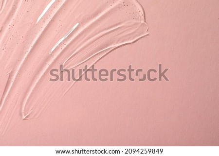 Cosmetic gel on pink background, top view. Space for text
