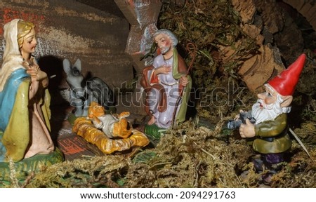 Nativity scene with gnome photographer