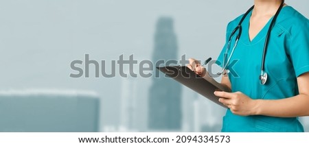 Healthcare workers, preventing virus, quarantine campaign concept. Smiling friendly female doctor, nurse in scrubs writing dorn results analysis at clipboard, standing white background
