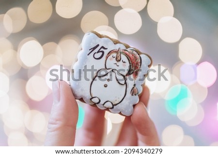 gingerbread advent calendar on the background of Christmas lights