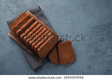 Fresh rye bread cut into slices top view. Copy space