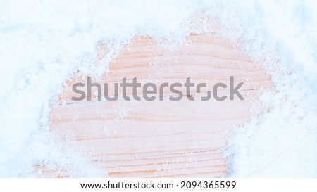Table snow. Winter wooden texture background. Christmas board with old rustic wood wall, white frozen ice. Merry Christmas holiday card pattern.