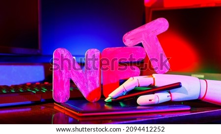 NFT Non-Fungible token. Artificial hand creates crypto art using a graphics tablet. Futuristic content creation story for the metaverse Royalty-Free Stock Photo #2094412252