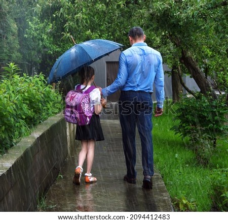 Cute 2 happy young adult coupl good safe relation little bag learn donate save hide under wet drop fall water symbol scen. Spring day baby outside urban town street yard garden nature scenic rear view Royalty-Free Stock Photo #2094412483