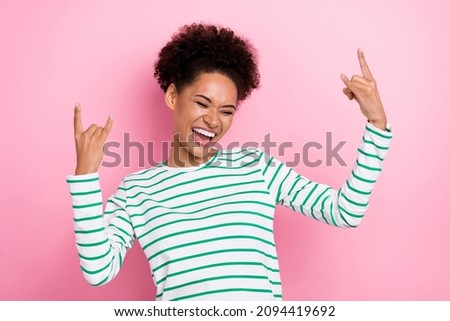 Portrait of attractive cheerful girl showing double horn having fun dancing isolated over pink pastel color background Royalty-Free Stock Photo #2094419692