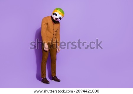 Full length photo of unsatisfied red panda head person head down bad mood isolated on purple color background