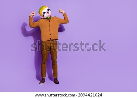 Full body photo of sloth head mask person stretching arms sleepiness isolated on purple color background