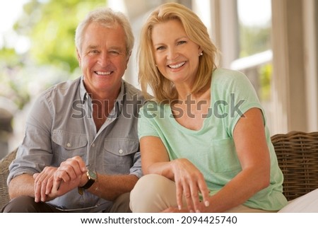 Portrait of smiling couple on patio