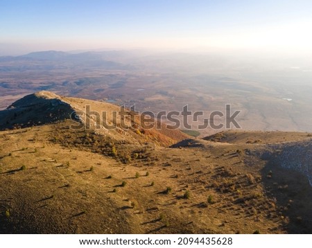 Aerial Autumn sunset view of Konyavska mountain near Viden Peak, Kyustendil Region, Bulgaria