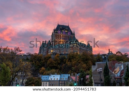 Quebec City Old Town street view in autumn dusk, stunning pink clouds over the sky in evening. Text in French is "Funicular".