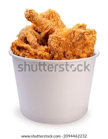 Fried chicken in paper bucket isolated on white background, Fried chicken on white With clipping path. Royalty-Free Stock Photo #2094462232
