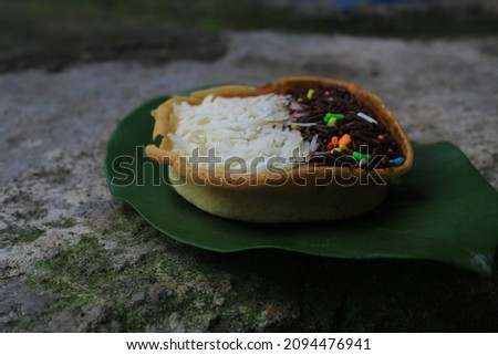 Not focus, Martabak Manis Mini is Indonesian dessert. Sweet Martabak Bangka with chocolate, cheese. this picture in white background and blurry, selective object, with eight different toppings. Indone
