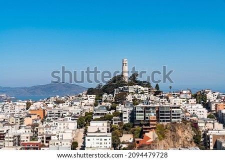 Panoramic picturesque cityscape view of San Francisco from above on clear blue summer day towards Coit Tower and Telegraph Hill, California, United States.