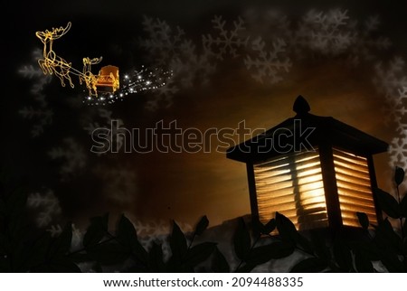 Merry Christmas and Happy New Year concept, close-up of the lantern Santa Claus sleigh background and golden deer sparkling with white snowflakes.Winter holiday banner greeting card.