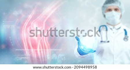 Joint pain, the doctor looks at the hologram of the knee joint. X-ray image, trauma, rheumatologist consultation, skeletal image, medical concept, medical technologies of the future Royalty-Free Stock Photo #2094498958