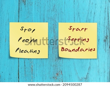 Two notes stick on blue wood background STOP PEOPLE PLEASING - START SETTING BOUNDARIES, concept of people pleaser start to let go the need to be perfect, approval addiction and start to set boundary Royalty-Free Stock Photo #2094500287