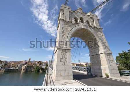 Bridge on the Ebro river in Amposta, Delta del Ebro, Catalonia, Spain Royalty-Free Stock Photo #209451331