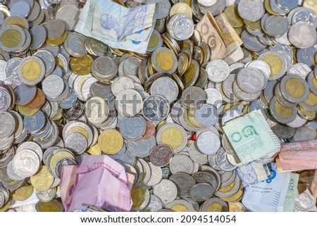 Large number of Thai currency mixed, money, saving money, coins, bills, banknote, paper money, horizontal, close up