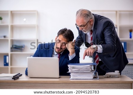 Two male colleagues working in the office Royalty-Free Stock Photo #2094520783