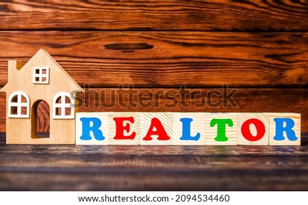 Wooden home and text on the cubes REALTOR 