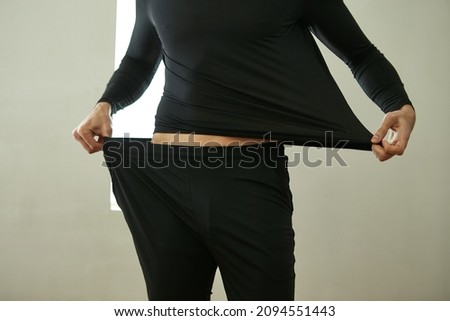 Testing the elasticity of clothes. Royalty-Free Stock Photo #2094551443