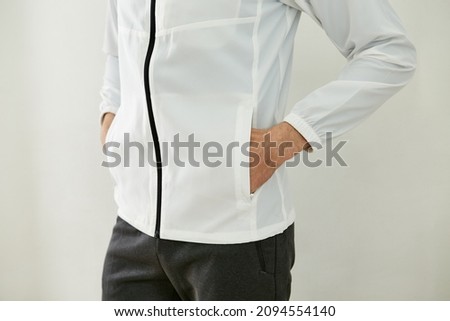 A man who puts his hand in his pocket. Royalty-Free Stock Photo #2094554140