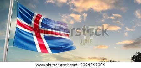 Iceland national flag cloth fabric waving on the sky with beautiful sky - Image
