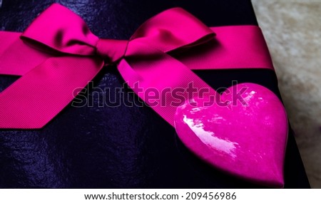 Pink heart and gift box with bow. 