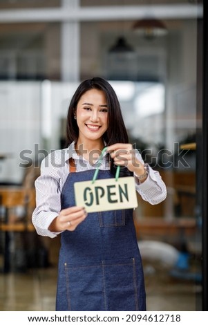 Welcome. Open. barista, waitress woman turning open sign board in modern cafe coffee shop ready to service, cafe restaurant, retail store, small business owner, food and drink concept