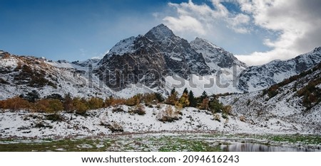 travel to Caucasus mountains in Karachay-Cherkessia, Arkhyz. Beautiful Autumn mountain landscapes, snow caps on tops of mountains. the road to Lake Orlyonok from Taulu glade