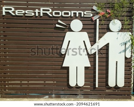 Male and female restroom signs at various locations