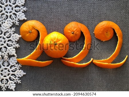 The number 2022 of tangerines on a gray background