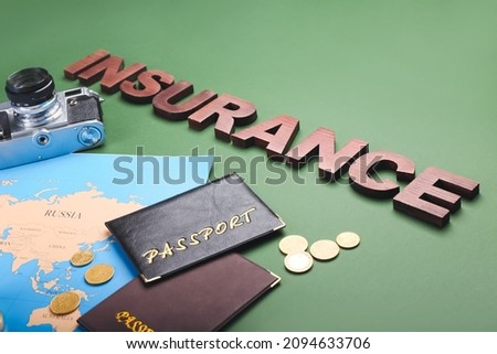 Composition with word INSURANCE and passports on color background, closeup