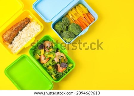 Containers with healthy food on color background, closeup