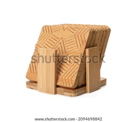 Stylish wooden cup coasters and holder on white background