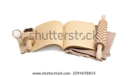 Blank recipe book, spices and wooden utensils on white background. Space for text