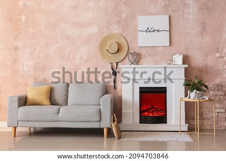 Interior of stylish living room with fireplace