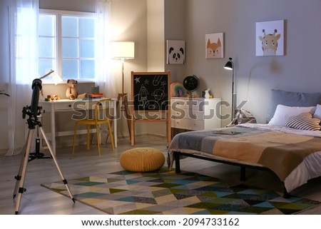 Interior of child's room with telescope in evening Royalty-Free Stock Photo #2094733162