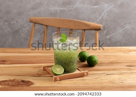 Indonesian Vegetarian Drink Es Timun Serut made from Shredded Cucumber, Lime Juice, and Basil Seeds Royalty-Free Stock Photo #2094742333
