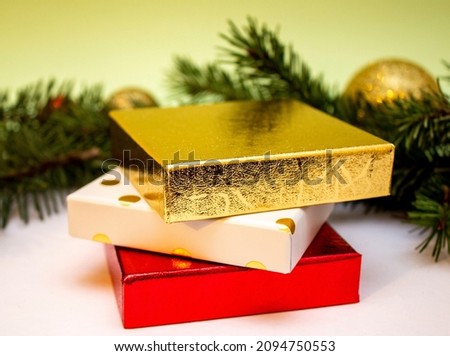 Red and gold box close up on New Year's background. Holiday concept